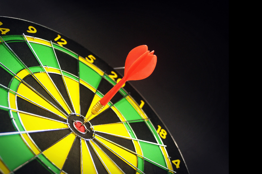 a dartboard with a red dart in the center